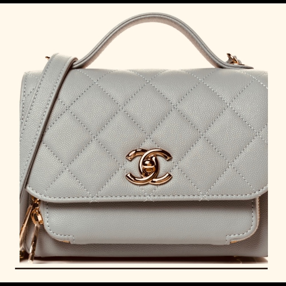 Chanel top handle flap bag